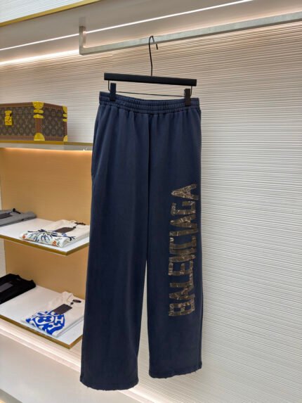 Balenciaga Distressed Trousers with Tape Lettering