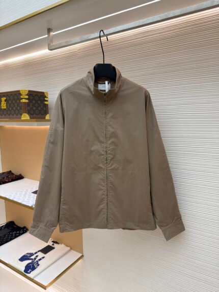 THE ROW Long-Sleeve Jacket with Stand Collar, Zip Closure, and Side Pockets